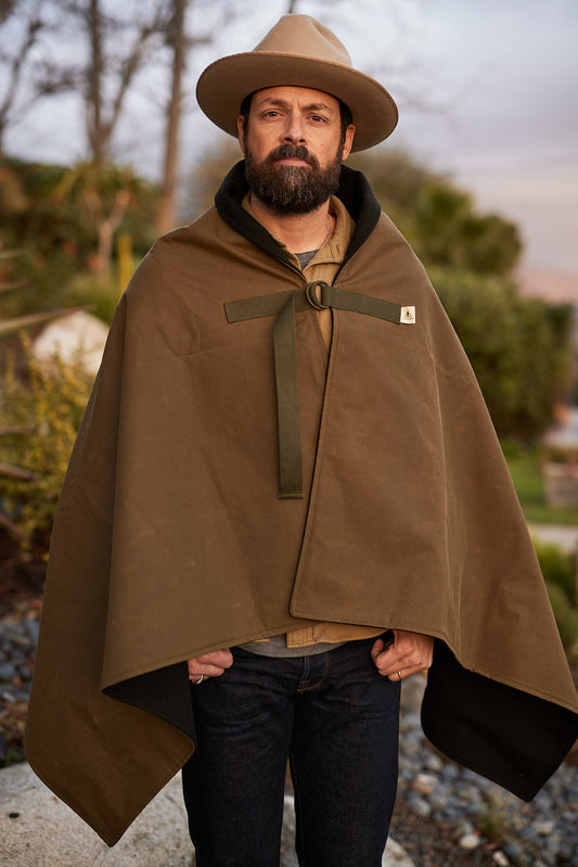Person wearing Bandido Poncho waxed canvas and wool
