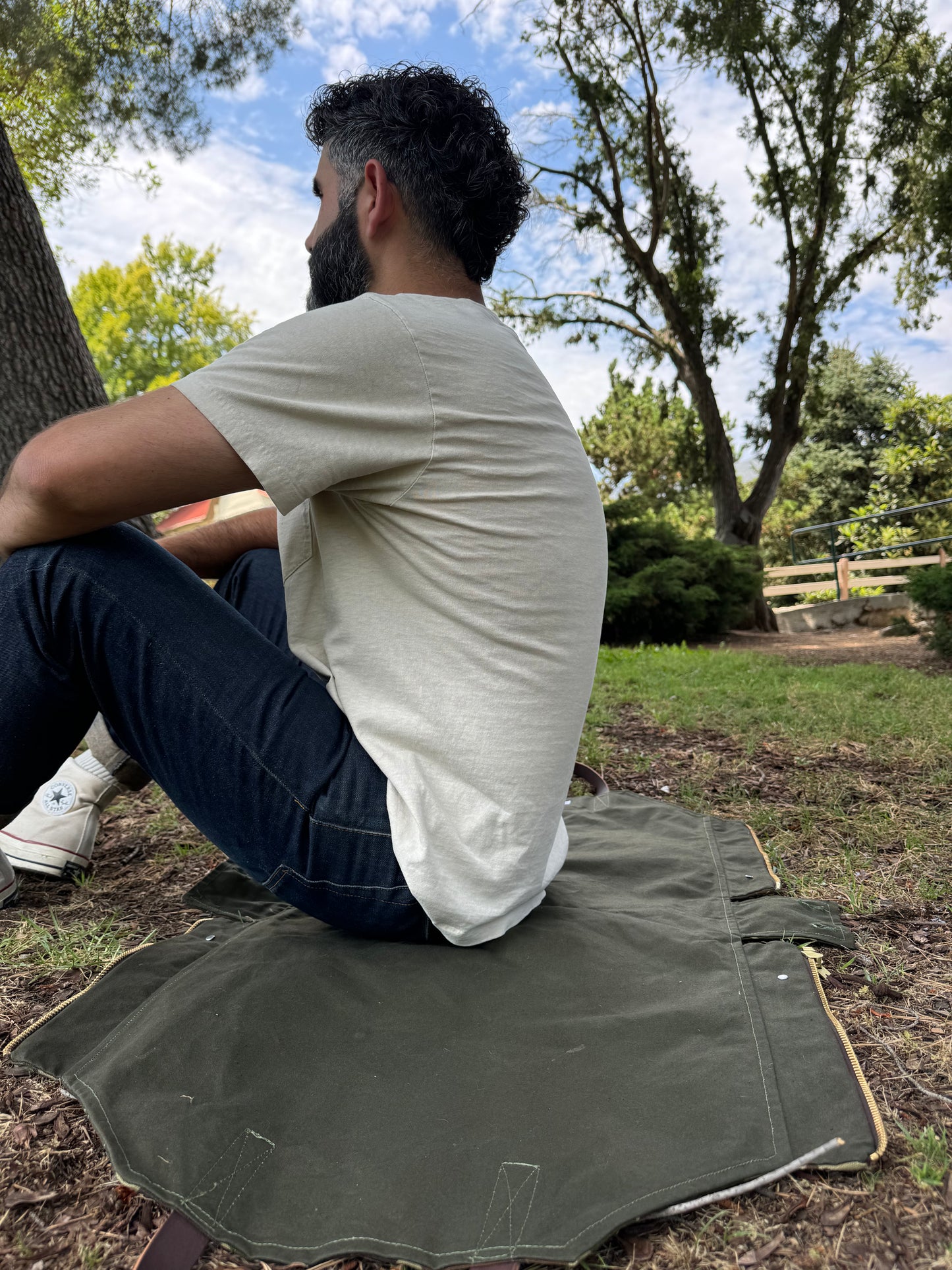 Person sitting on Newcomb Convertible Tote