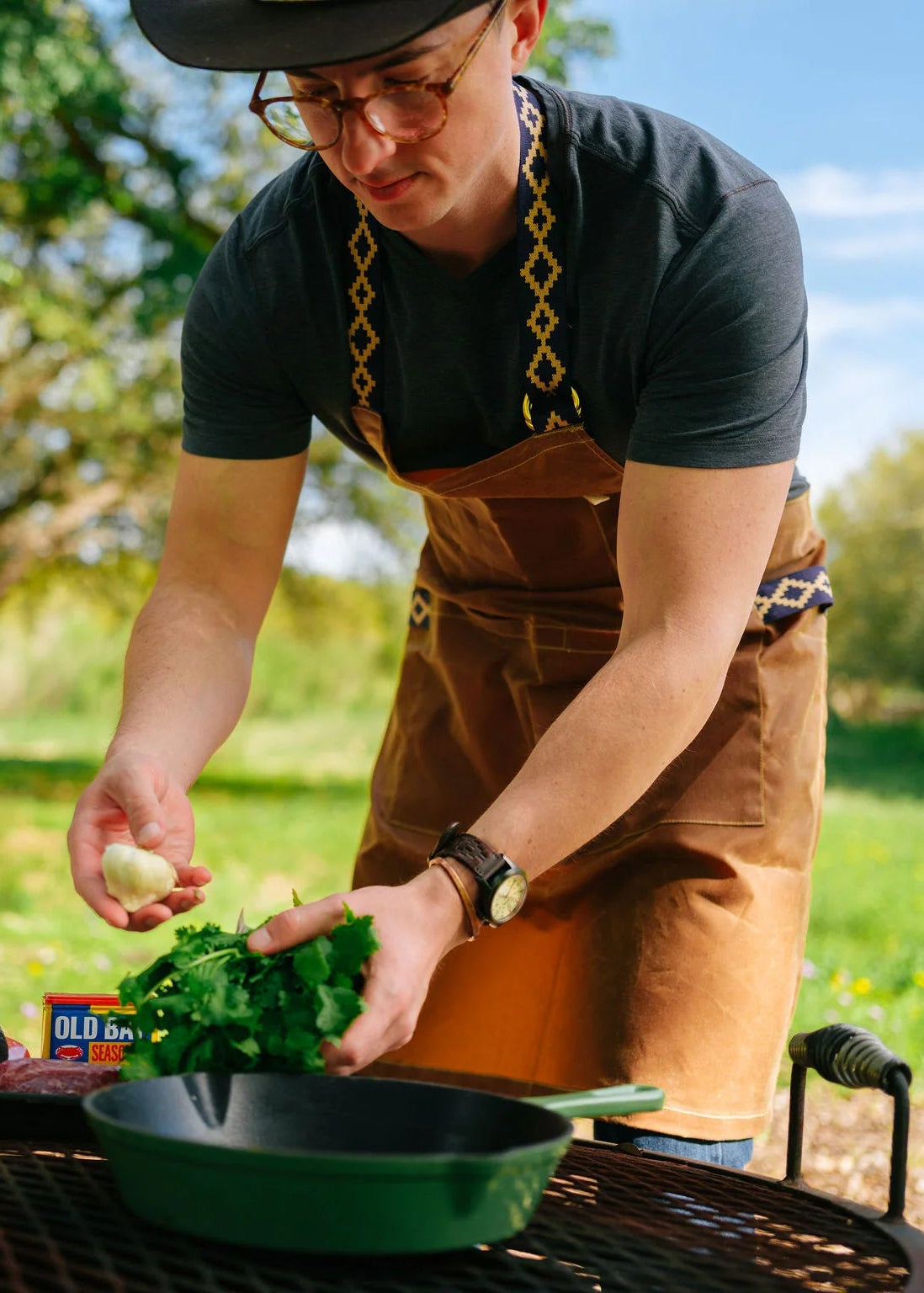 Person wearing The Buckhorn Apron Chilao x La Matera