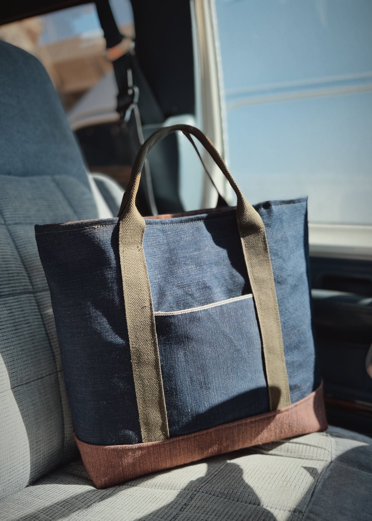The Ventreman waxed canvas tote bag with military webbing handles