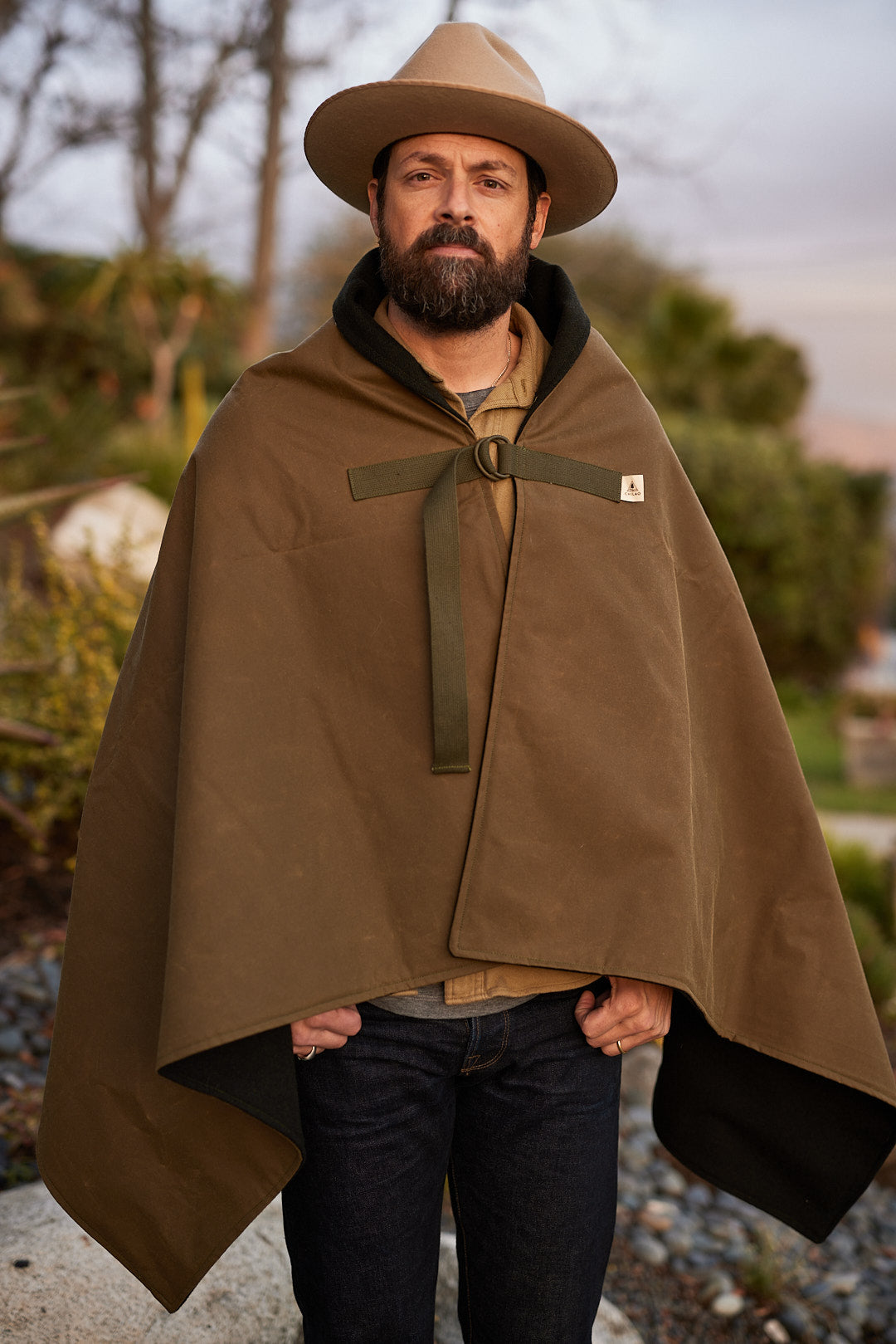 Person wearing Bandido Poncho waxed canvas and wool