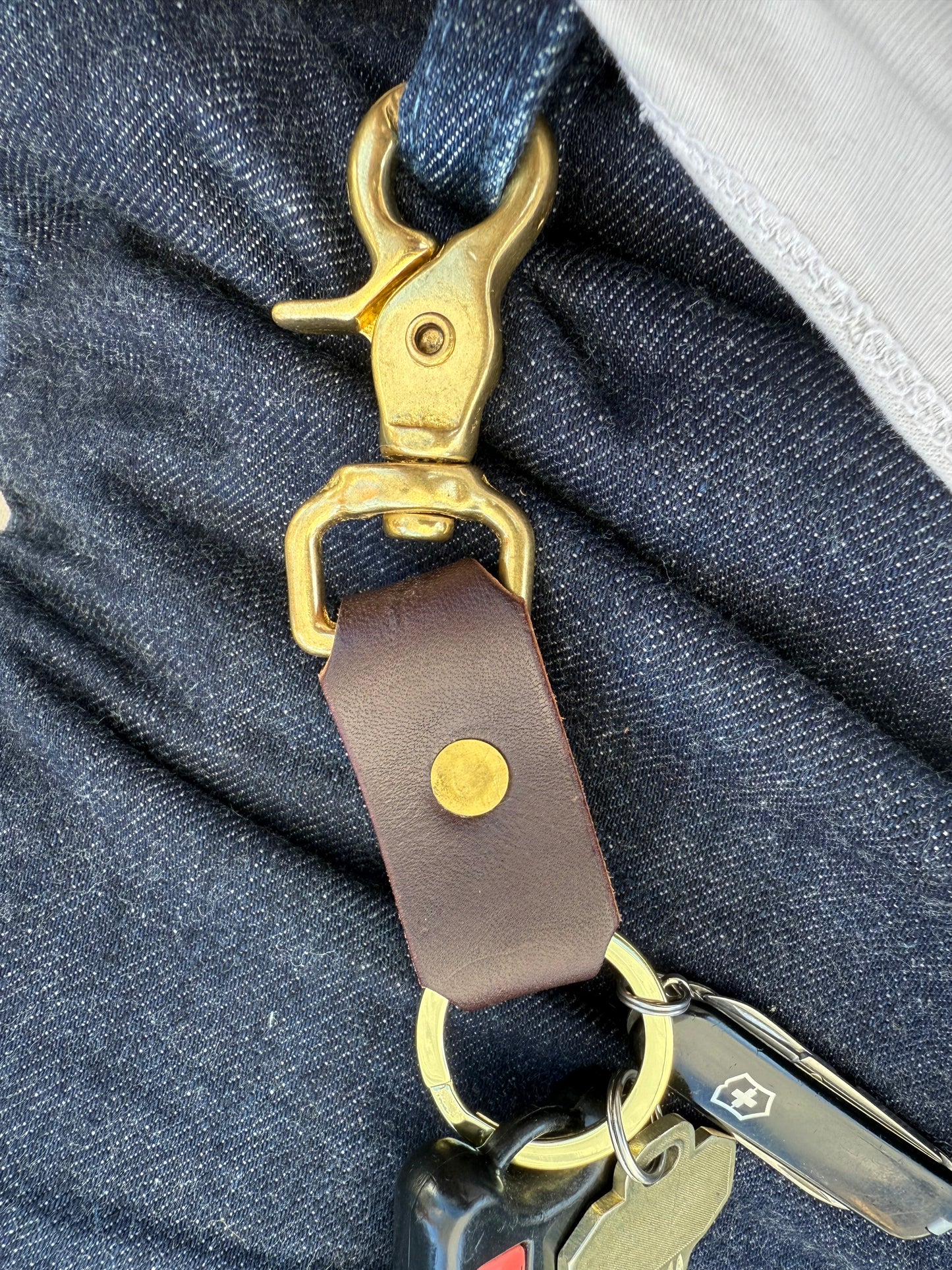 Brass and leather keychain holding keys
