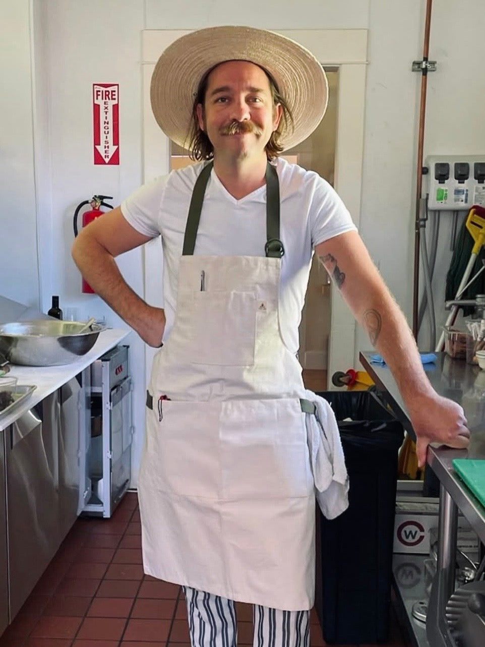 Buckhorn Apron in Natural Canvas with adjustable D-ring straps and multiple pockets