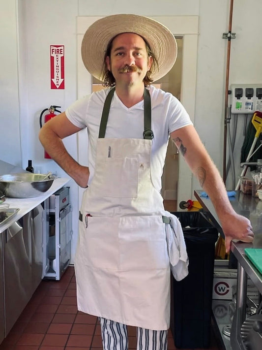 Buckhorn Apron in Natural Canvas with adjustable D-ring straps and multiple pockets