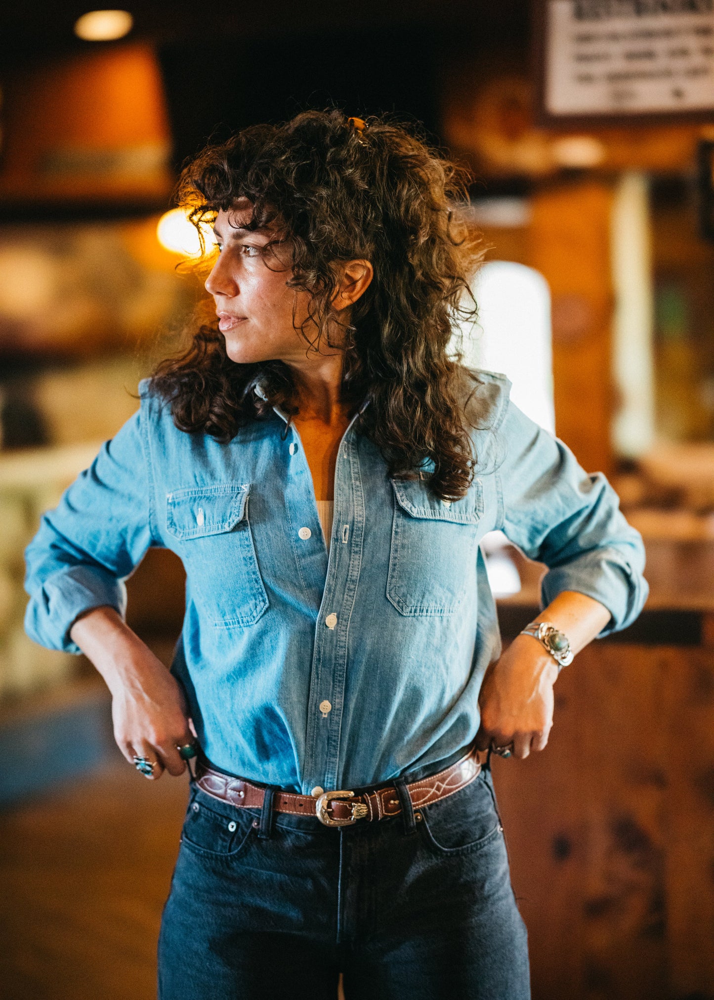 Women wearing Lone Pine Japanese light wash denim shirt tucked in
