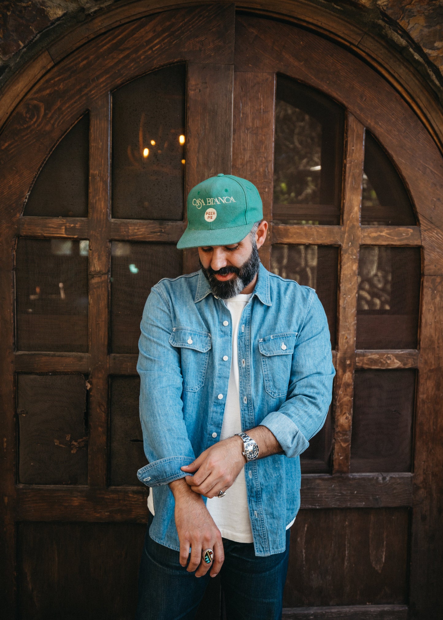 Person wearing Lone Pine Japanese denim shirt rolling up their sleeve