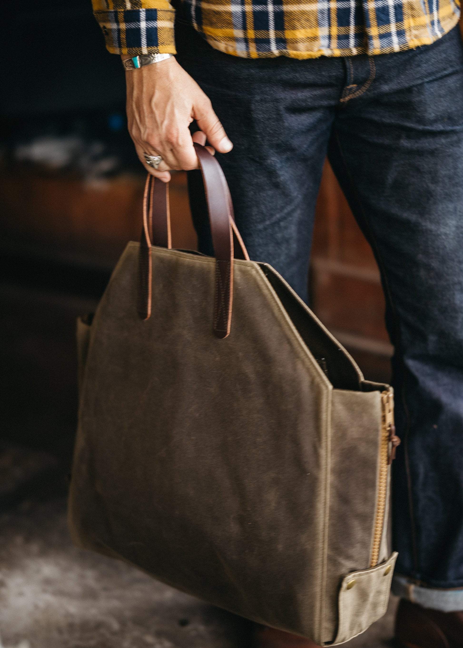 Newcomb brown waxed canvas tote - side view showing convertible design and deadstock zipper