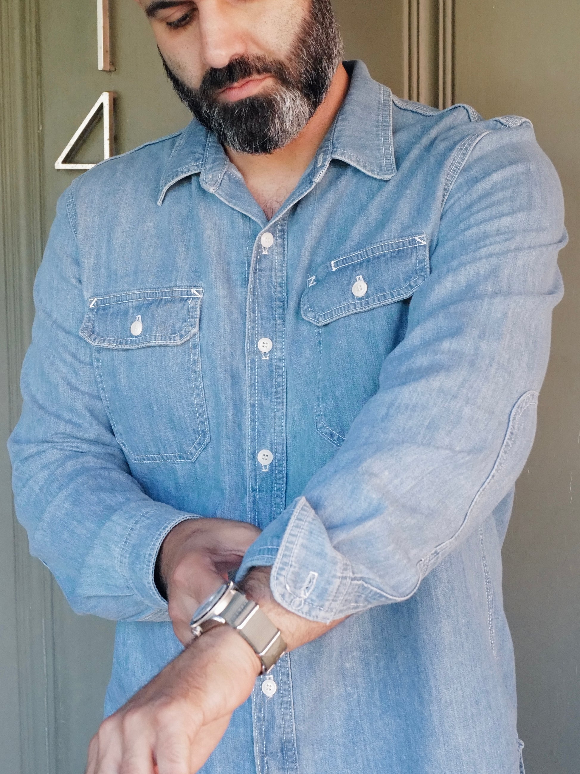 Person wearing Lone Pine light wash denim shirt