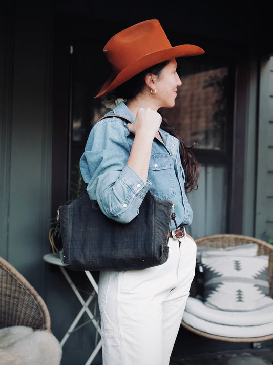 Mini Newcomb tote in plaid waxed canvas showing compact size