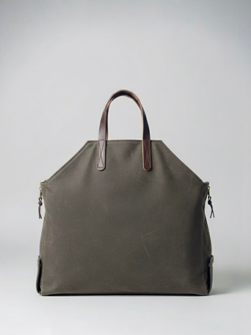 Newcomb leather handles and brass hardware detail