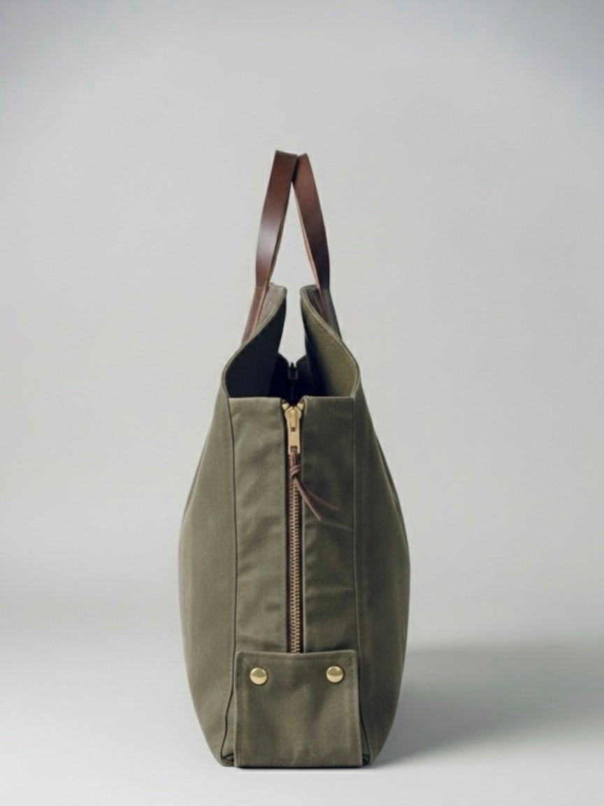 Newcomb log tote in brown waxed canvas with leather handles