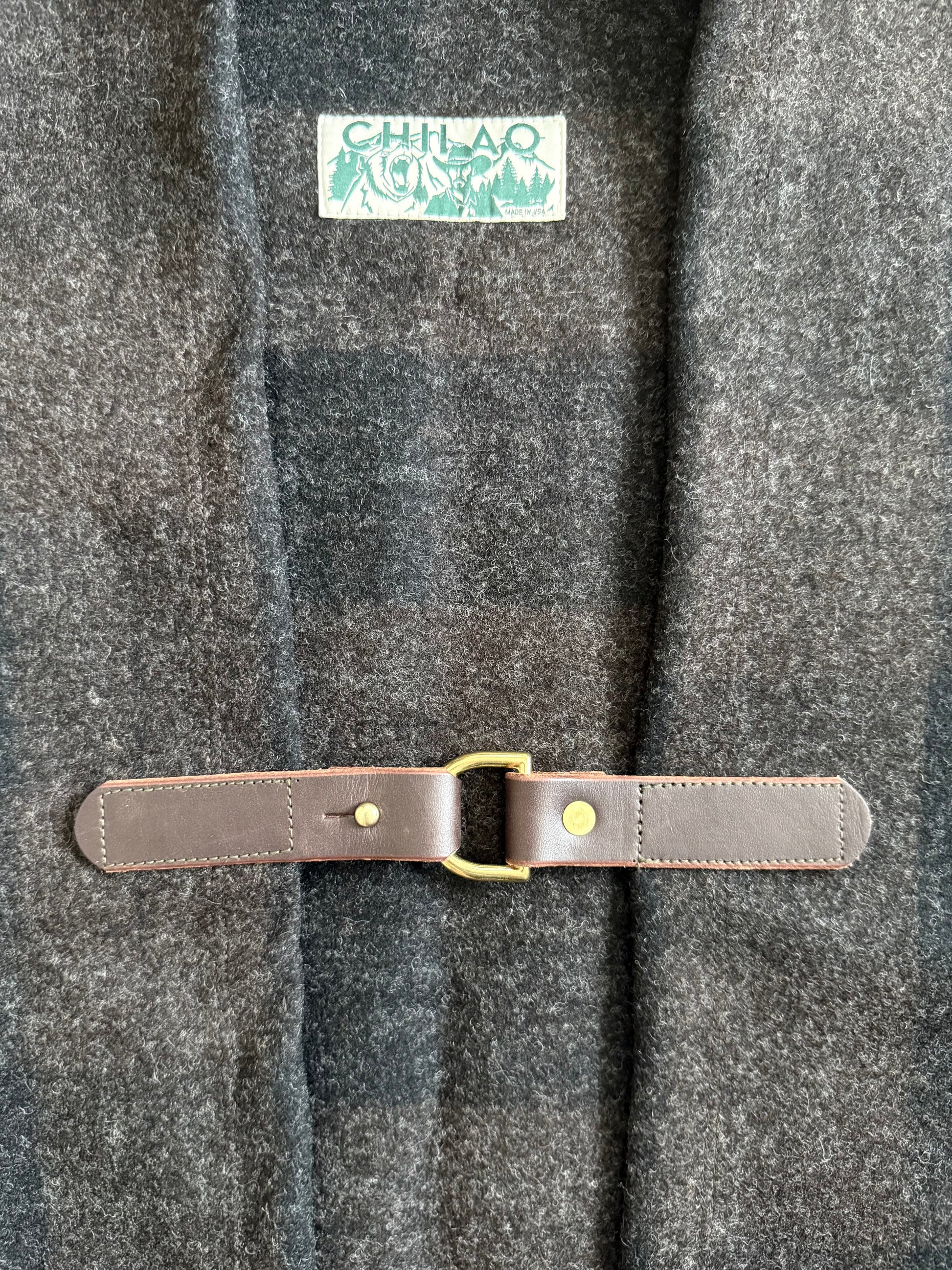 Pine Mountain Poncho leather clasp and brass hardware detail