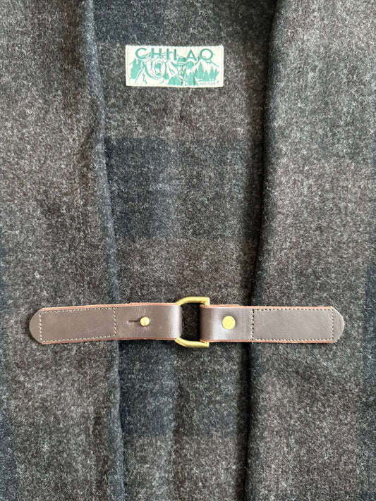 Pine Mountain Poncho leather clasp and brass hardware detail