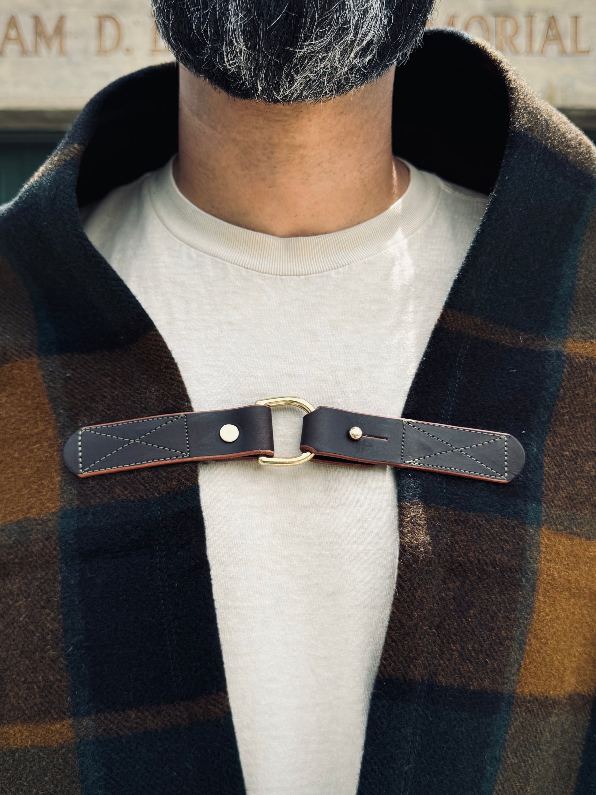 Pine Mountain Poncho leather handmade clasp with brass d-ring