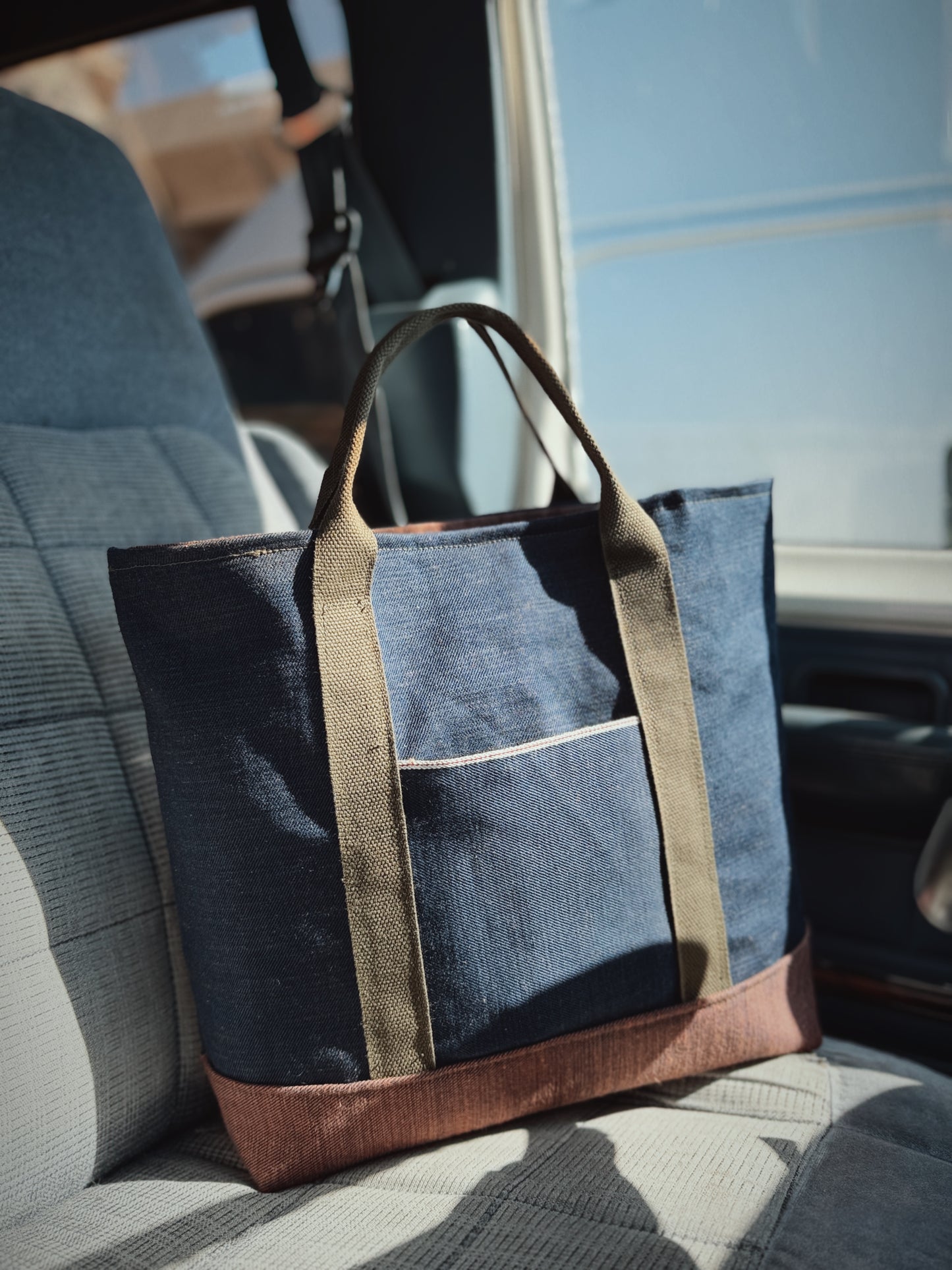 The Ventreman waxed canvas tote bag with military webbing handles